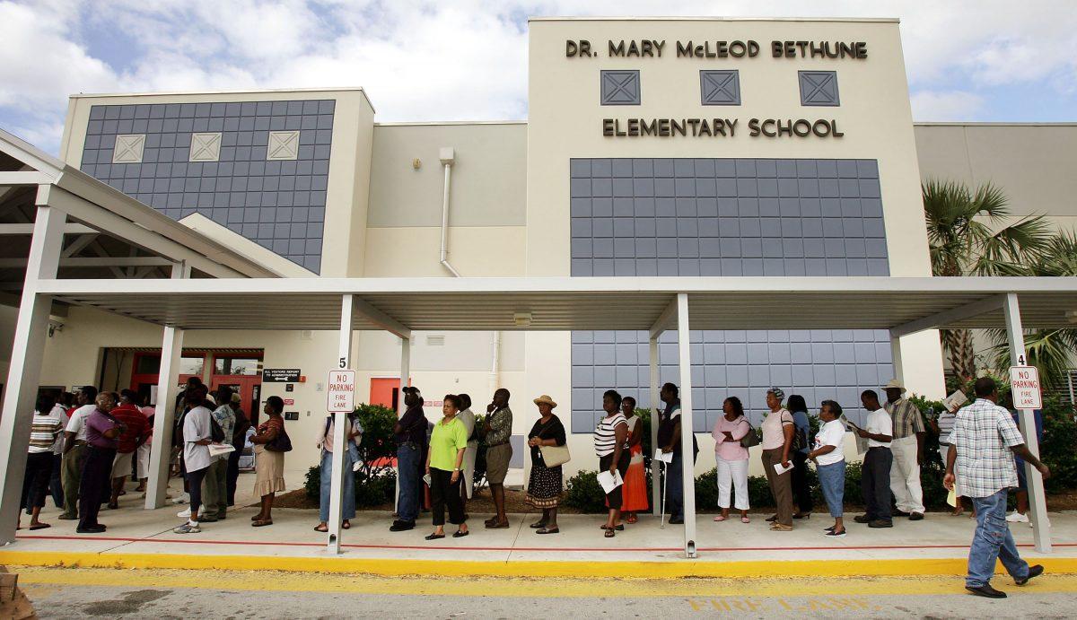 Voters wait in line to cast their ballots in Riviera Beach, Florida on Nov. 2, 2004. (Mario Tama/Getty Images)