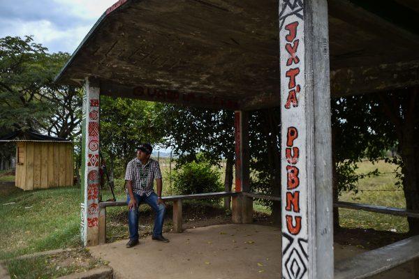 Juan Chindicue, a community leader threatened to death by illegal armed groups, waits for a bus in Caloto, Cauca Department, Colombia, on July 17, 2018. (Luis Robayo/AFP/Getty Images)