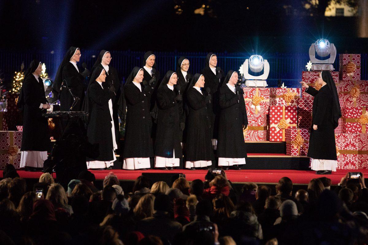 The Dominican Sisters of Mary perform at the lighting of the National Christmas Tree in Washington on Nov. 28, 2018. (Samira Bouaou/The Epoch Times)