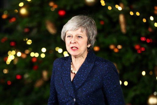 Britain's Prime Minister Theresa May speaks outside 10 Downing Street after a confidence vote by Conservative Party members of Parliament (MPs), in London, on Dec. 12, 2018. (Hannah McKay/Reuters)