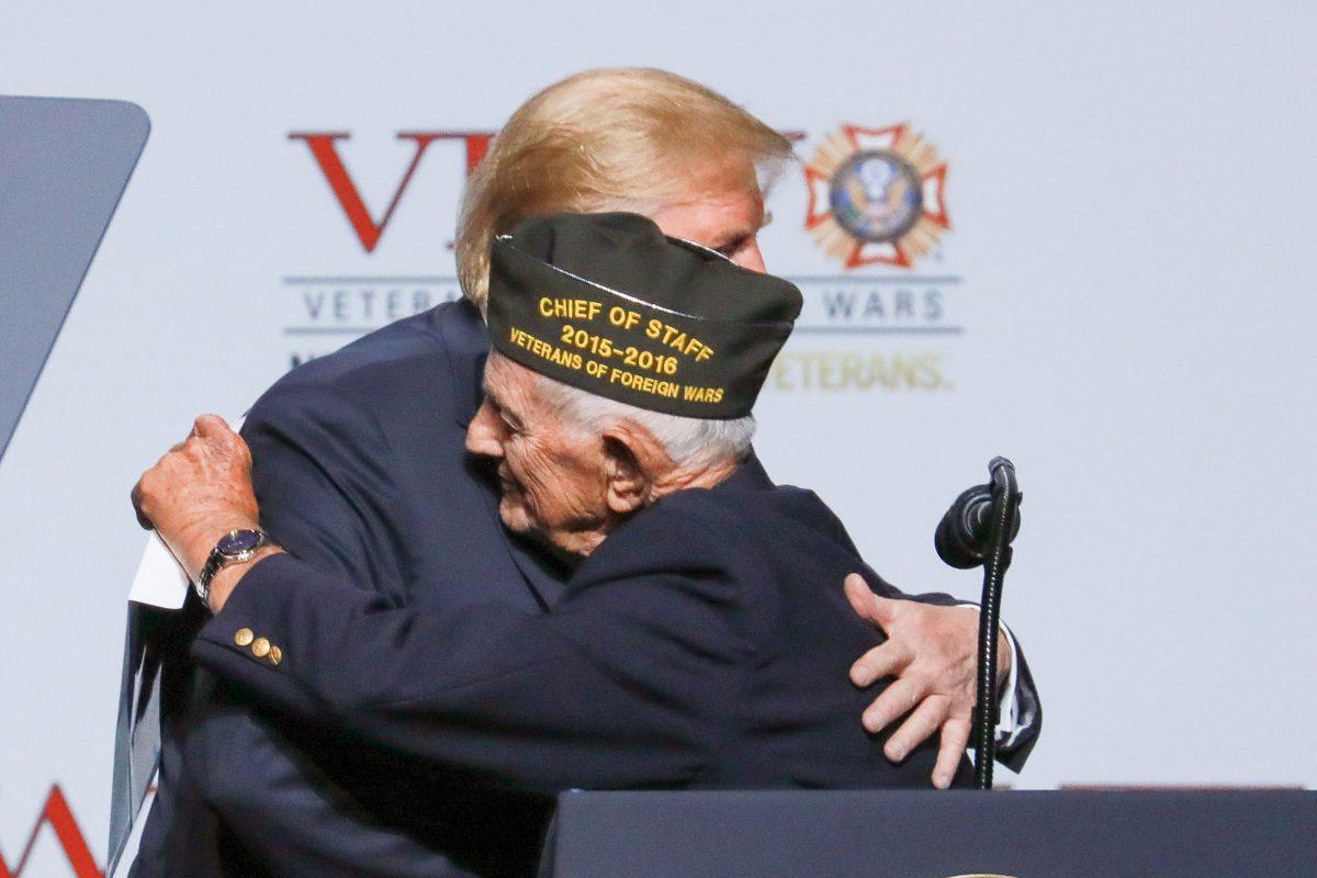 President Donald Trump embraces 94-year-old World War II veteran Allen Q. Jones at the 119th annual Veterans of Foreign Wars conference in Kansas City, Mo., on July 24, 2018. (Charlotte Cuthbertson/The Epoch Times)