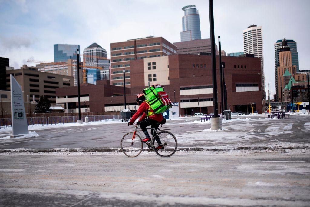 A bicyclist braves the cold while riding through downtown in Minneapolis, Minn., on Jan. 29, 2019. (Stephen Maturen/AFP/Getty Images)