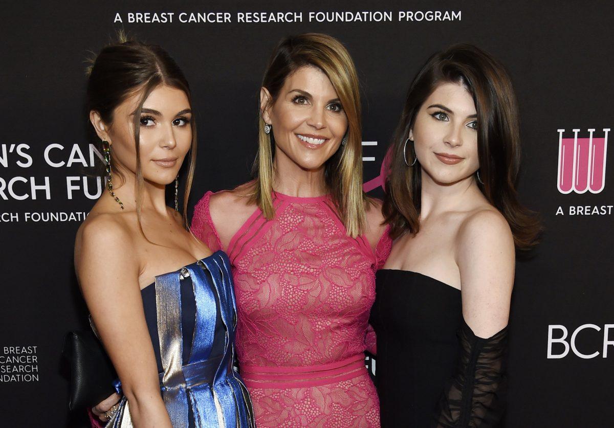 Actress Lori Loughlin, center, poses with daughters Olivia Jade Giannulli, left, and Isabella Rose Giannulli at the 2019 "An Unforgettable Evening" in Beverly Hills, Calif., on Feb. 28, 2019. (Chris Pizzello/Invision/AP)