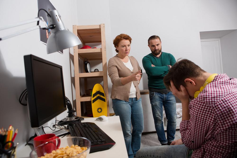 The distraught parents revealed to their kids that "Amanda" didn't really exist (Illustration - Shutterstock | <a href="https://www.shutterstock.com/image-photo/parents-scolding-their-teenage-son-his-703908943?studio=1">Lipik Stock Media</a>)