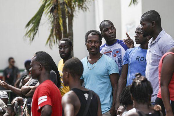 Migrants, mostly from Haiti and Africa, wait for an appointment to obtain legal travel documents at a National Institute of Migration detention center in Tapachula, Mexico, on June 24, 2019. (Charlotte Cuthbertson/The Epoch Times)