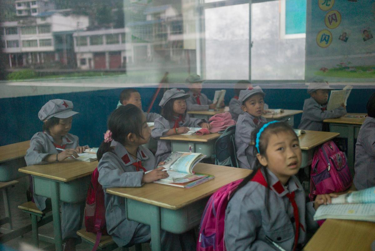 Students in their classroom in the Yang Dezhi "Red Army" elementary school in Wenshui, Xishui County, in Guizhou Province, China, on Nov. 7, 2016. (FRED DUFOUR/AFP via Getty Images)