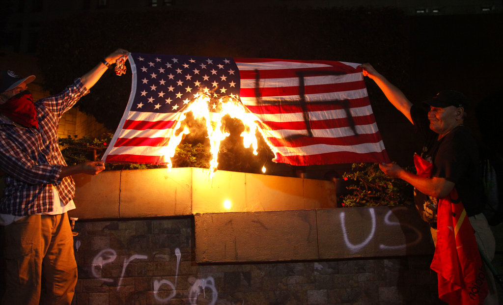 hondurans-burn-american-flag-outside-emb